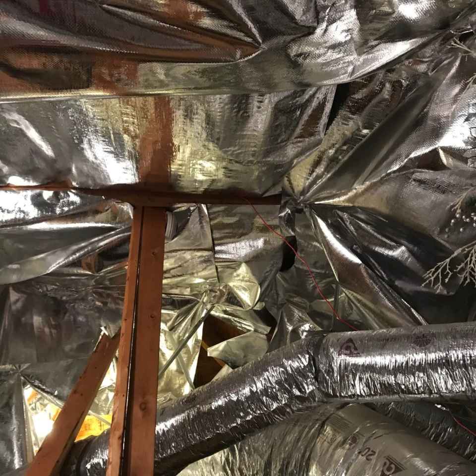 Close-up view of ES® RFID Radiant Barrier installed in an attic