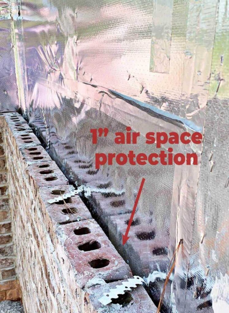 In this image, a 1" air space is visible between ES® RFID Radiant Barrier and the brick exterior of Hillary Farr's home. The radiant barrier, as seen on Love It Or List It Season 19, Episode 2, is an energy-efficient house wrap that helps to keep the interior cool while adding a stylish metallic finish to the exterior of the home. The air space between ES® RFID Radiant Barrier and the brick allows for better air circulation and further enhances the energy efficiency of the home.