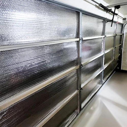 Garage door insulation kit with reflective bubble radiant barrier reducing heat and energy loss