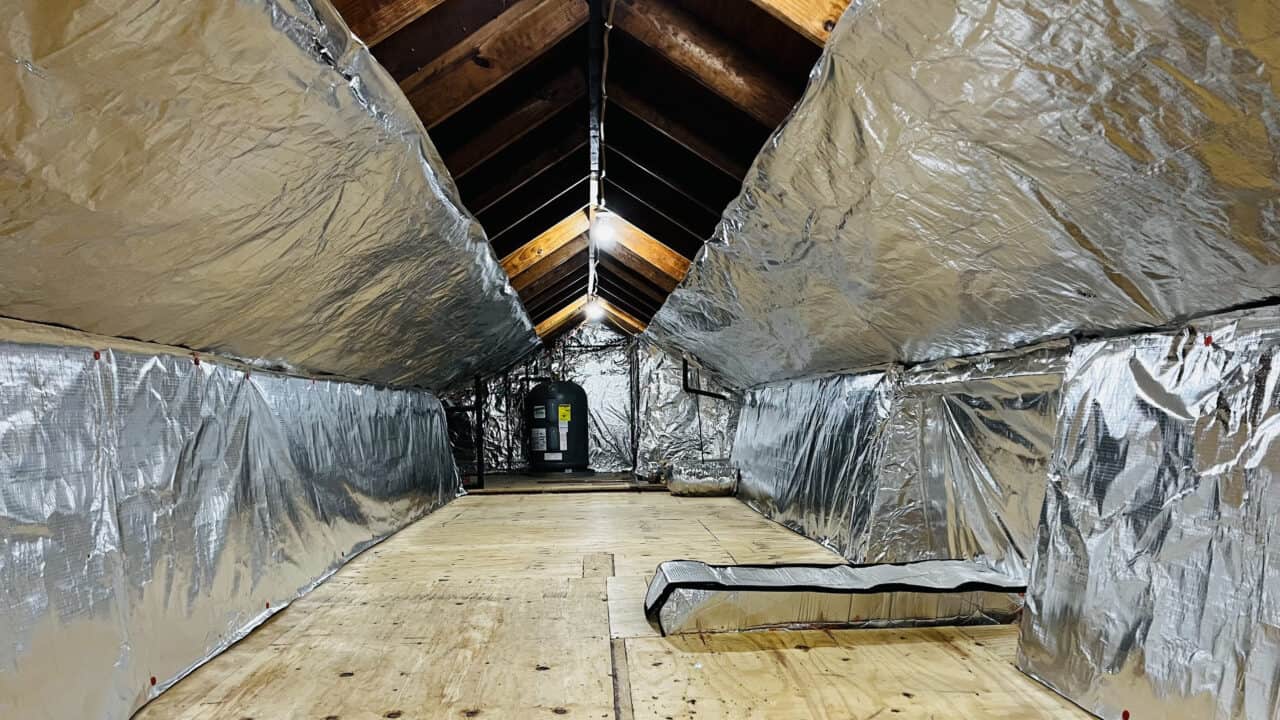 Radiant barrier foil insulation installed beneath attic roof rafters