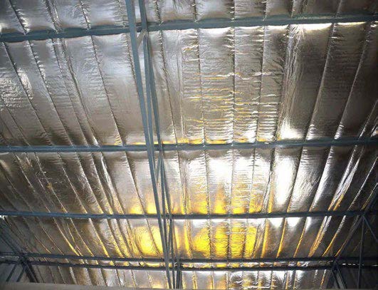 Reflective bubble insulation installed in a metal building to enhance energy efficiency and reduce condensation buildup.