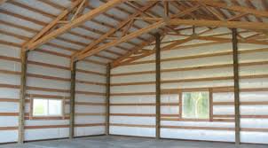 Reflective bubble insulation installed in a pole barn or post-frame building to reduce heat transfer and control condensation.