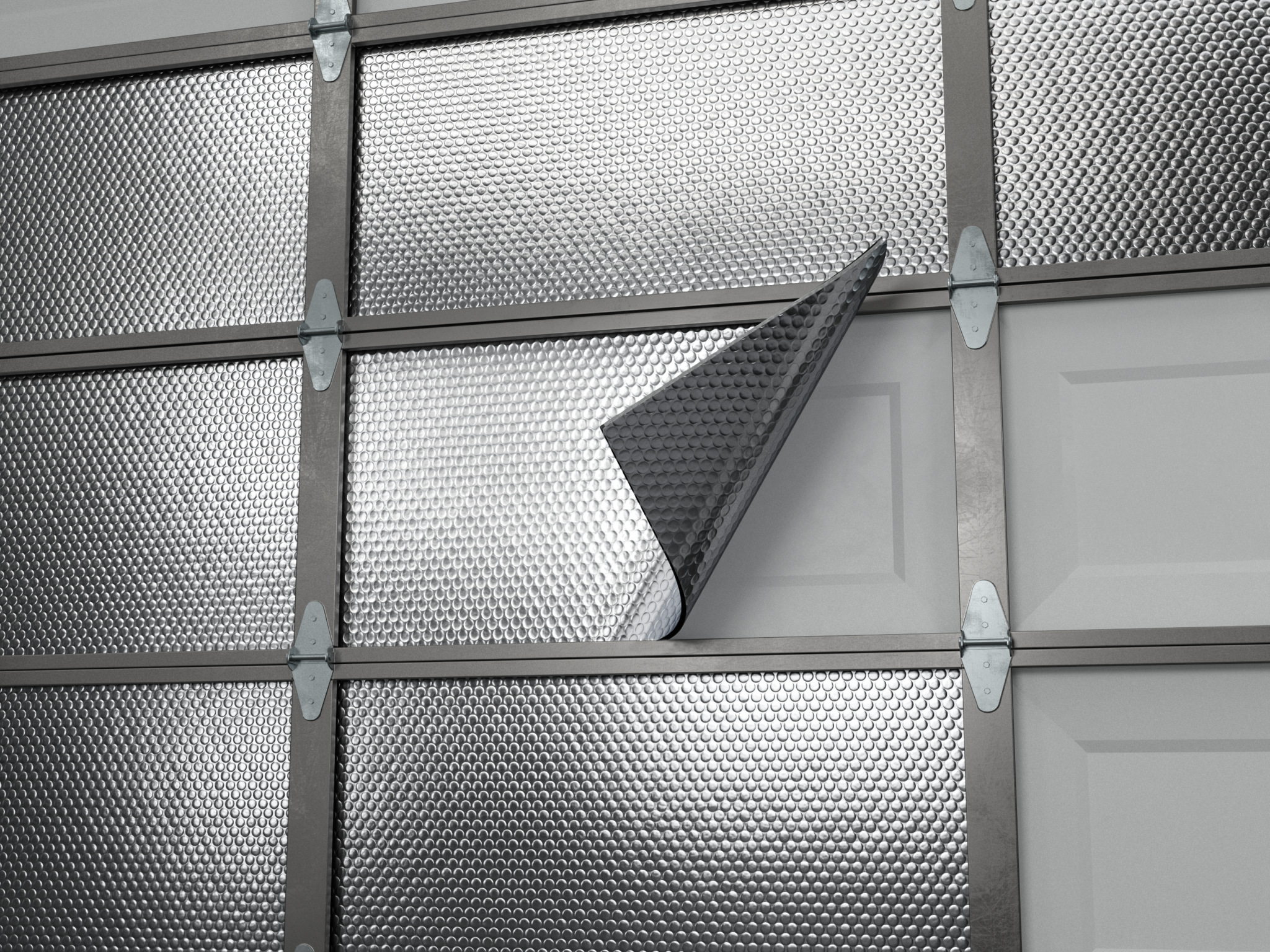 Homeowner installing reflective insulation panels on a garage door for improved energy efficiency