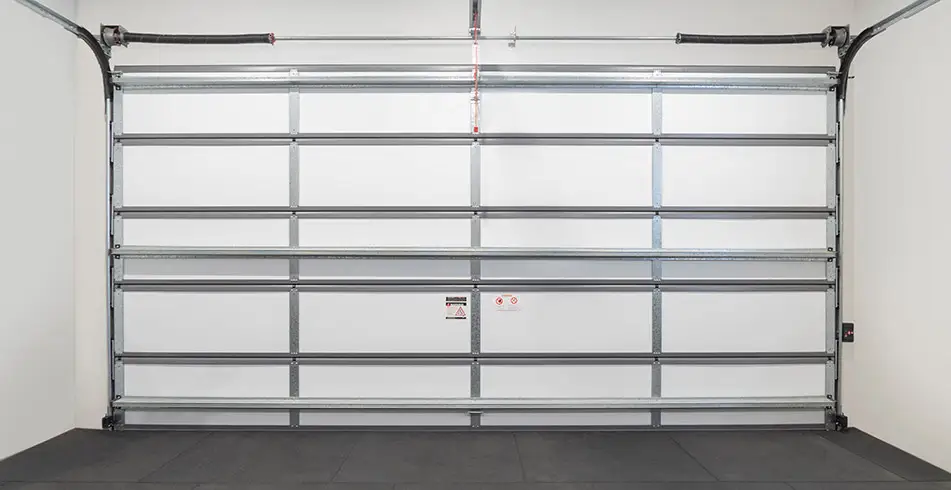 Foam garage door insulation panels installed to improve energy efficiency and comfort