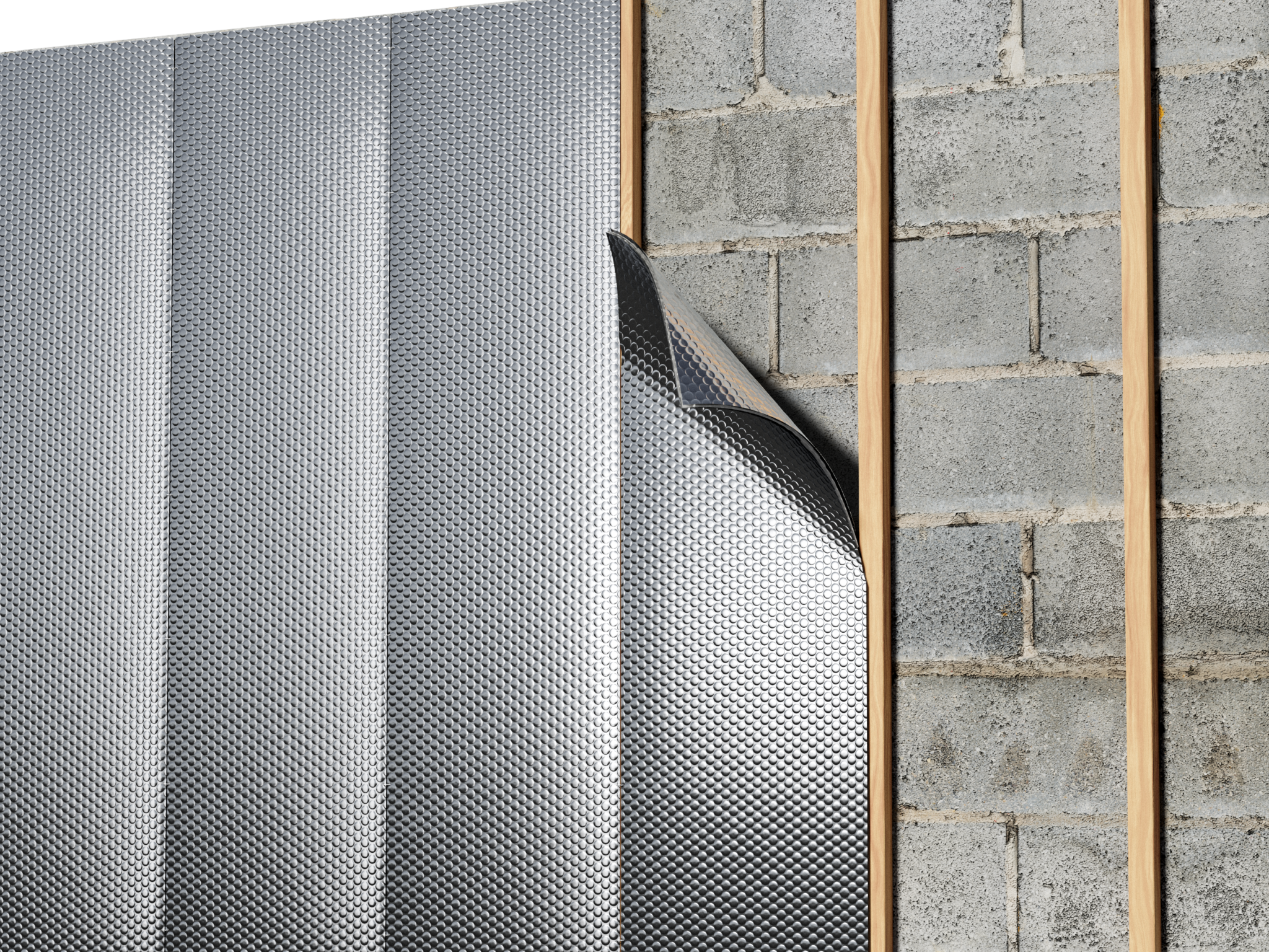 Basement block wall insulated with reflective bubble or reflective foam insulation installed over furring strips.