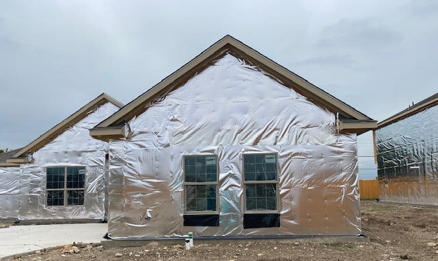 Home exterior wrapped with Energy Shield® radiant barrier house wrap for energy efficiency