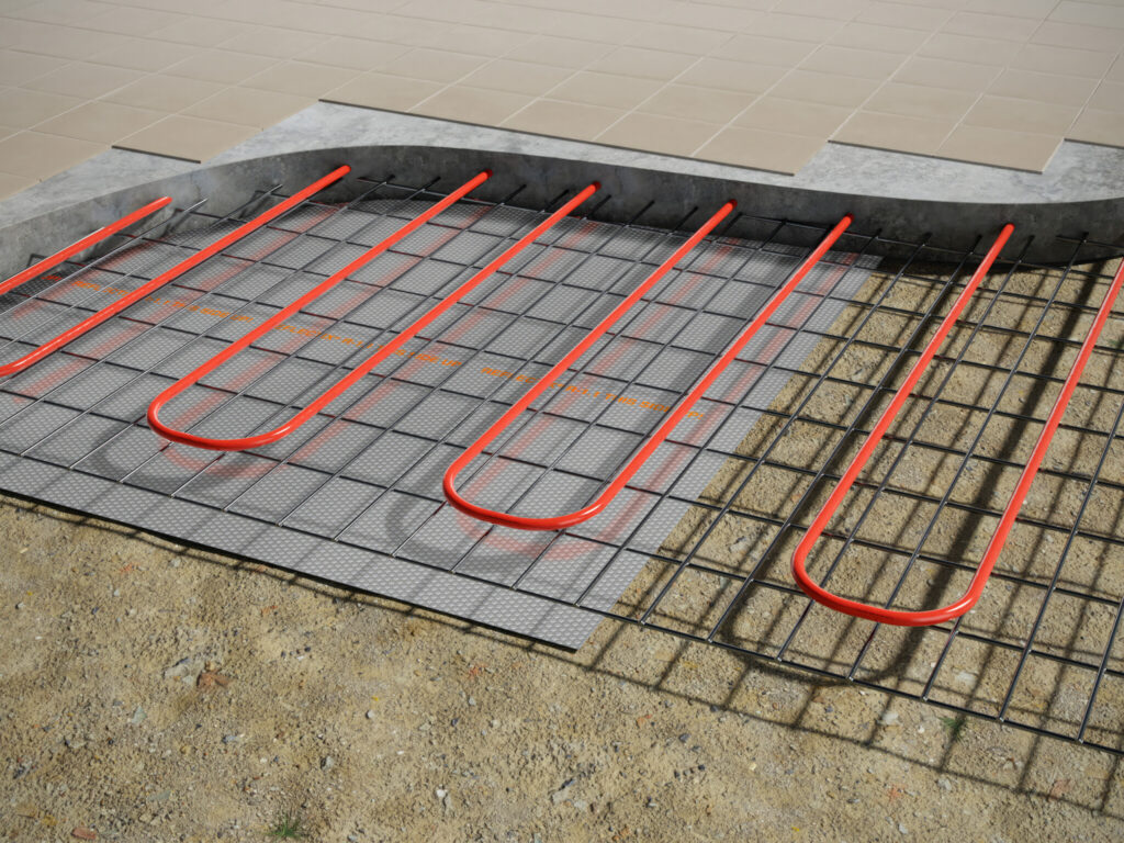 Reflective radiant floor insulation installed under concrete slab for radiant heating system